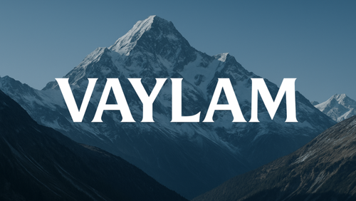 Create a modern and visually appealing logo for a store named VAYLAM. The design should be clean, stylish, and professional, with bold and elegant typography. Behind the logo, include a beautiful mountain landscape — preferably something like the Alps — to give a natural, majestic, and powerful feeling. The mountains should complement the logo without overpowering it. The final result should be suitable for both digital and print use. Deliver the logo in high resolution with a transparent background.